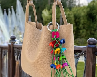 Cassidy’s Leather flower fringe purse charm in some colors