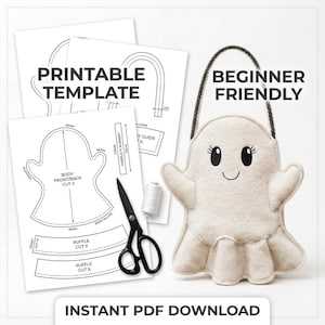 May include: A craft project featuring a white felt ghost with black embroidered eyes and a mouth, a black handle, and printed paper templates labelled PRINTABLE TEMPLATE and BEGINNER FRIENDLY, alongside black scissors and a spool of white thread.