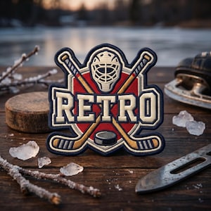 May include: An embroidered patch featuring a red circular background with a white hockey goalie mask at the top, two crossed hockey sticks, and a black hockey puck at the bottom. The word RETRO is stitched in large, bold, cream-colored letters.