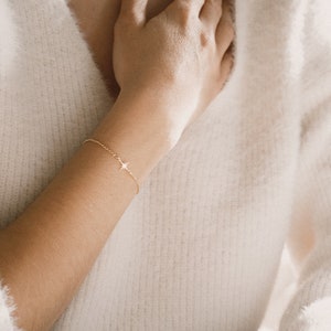 Missfallsarmband — Starburst North Star i sterlingsilver eller guldfyllt · Minnesarmband