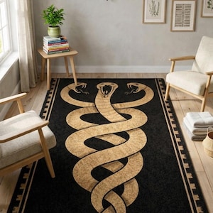 May include: Black rectangular rug with a large, intertwined snake design in gold. The rug has a border with a repeating geometric pattern. The rug is placed in a room with wooden flooring and neutral-toned walls.