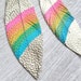 see more listings in the Painted Feather Earrings section