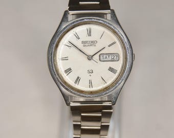 Vintage 1978 Gents Seiko SQ 7546-7070 Stainless Steel Quartz Day/Date Wristwatch