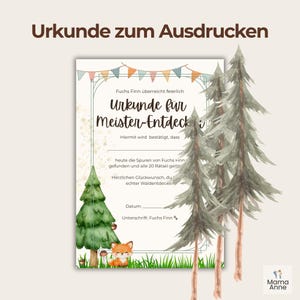 May include: A printable certificate with the text "Urkunde f&uuml;r Meister-Entdecker" in German. The certificate features a forest theme with illustrations of pine trees, a fox, and colorful bunting. The certificate is designed to be printed.