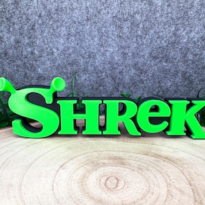 Puede incluir: Un juego de tres tazas de cerámica con un acabado mate moteado. Las tazas son de color crema, gris claro y gris oscuro. Cada taza tiene un diseño simple y minimalista y un asa redondeada.