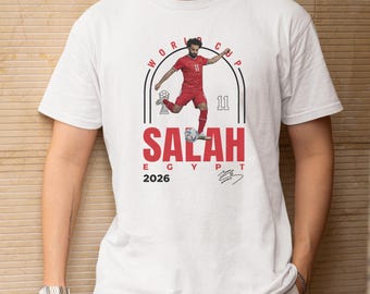 Camiseta gráfica de Salah, leyenda del fútbol egipcio, ropa para aficionados del Mundial 2026.