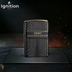 May include: Black Zippo lighter with a geometric pattern. The lighter has a gold-colored top and a black band with the Zippo logo and "LIMITED EDITION 0299/9999" text. The "Ignition House" logo is in the top left corner.