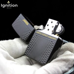 May include: A black Zippo lighter with a geometric pattern and gold lettering. The lighter is open, revealing the interior mechanism. The text "LIMITED EDITION 6286/9999" is visible. The "Ignition House" logo is in the top left corner.