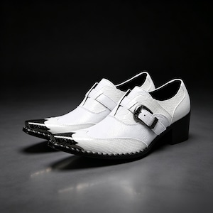 May include: A pair of white dress shoes with a textured snakeskin pattern, featuring a pointed black metal toe cap, a side buckle strap closure, and a black block heel. The shoes have a sleek silhouette with a polished finish and dark accents.