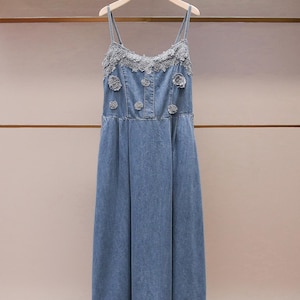 denim dress with lace undershirt This black denim dress is a dream! We also have the white lace undershirt! Come see us today or shop online!