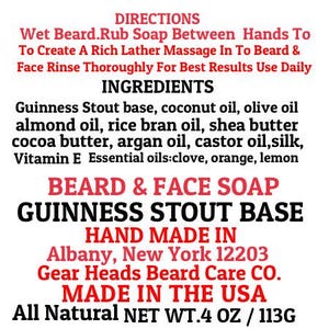 Pu&ograve; includere: Testo su sfondo bianco: "BEARD & FACE SOAP GUINNESS STOUT BASE HAND MADE IN Albany, New York 12203 MADE IN THE USA All Natural NET WT.4 OZ / 113G." Ingredienti: Guinness Stout, olio di cocco, olio d'oliva e altro.