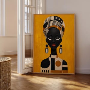 May include: A framed vertical wall art print featuring a stylised portrait of a person with dark skin, closed eyes, and red lips. The figure wears a patterned headwrap and geometric earrings against a solid mustard yellow background.