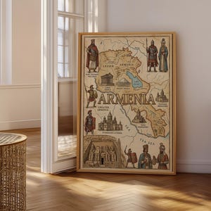 May include: A framed vintage map of Armenia, with illustrations of historical figures and landmarks. The map is in a wooden frame and is displayed against a neutral wall. The map includes the text "Armenia" and various place names.