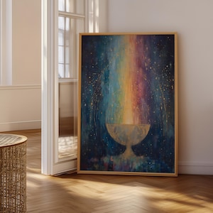 May include: A framed abstract painting with a rainbow-coloured vertical streak against a dark blue background. The artwork features a bowl-like shape at the bottom of the rainbow. The frame is a light brown colour. The painting is displayed in a room with a wooden floor.
