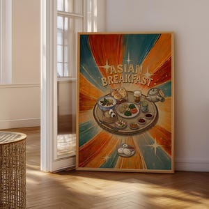 Op de afbeelding: Een ingelijste print met een illustratie van een Aziatisch ontbijt op een dienblad. Het kunstwerk heeft een retro-stijl met de woorden "ASIAN BREAKFAST" in gouden letters. De achtergrond heeft een radiaal ontwerp in oranje, blauw en rood.