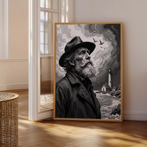 May include: A framed monochrome print depicting an elderly man with a long white beard and a hat, gazing upwards. The background shows a lighthouse, sea, and birds, evoking a nautical atmosphere. The artwork is displayed in a room with natural light.
