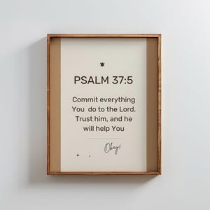 May include: Framed print with the text "PSALM 37:5" and the message "Commit everything You do to the Lord. Trust him, and he will help You." The frame is a warm brown color, and the background is off-white.
