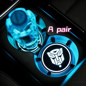 May include: A set of three ceramic mugs with a speckled, matte finish. The mugs are in shades of cream, light brown, and dark brown. Each mug has a rounded handle and a simple, modern design. Perfect for coffee or tea.