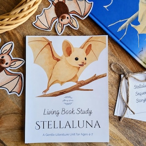 May include: A white educational booklet titled Living Book Study STELLALUNA A Gentle Literature Unit for Ages 4-7 featuring a watercolor illustration of a light brown bat perched on a brown branch, surrounded by bat-shaped paper cutouts.