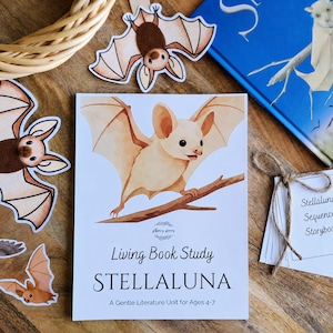 May include: A white educational booklet titled Living Book Study STELLALUNA A Gentle Literature Unit for Ages 4-7 featuring a watercolour illustration of a light brown bat on a branch, surrounded by several bat-shaped paper cutouts and a book.