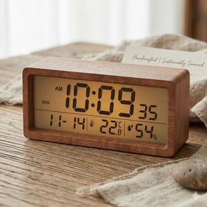 May include: A handmade wooden sign with the text "Welcome" in a playful font. The sign features a distressed white background and a dark brown border, perfect for a front door or entryway. Measures approximately 12 inches wide.