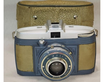 Fotocamera vintage Bilora Bella blu e argento con custodia originale, mai testata.