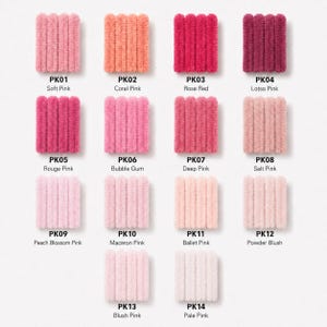 May include: A collection of fourteen swatches of fuzzy, textured yarn arranged in a grid. Each swatch is labeled with a code from PK01 to PK14 and a corresponding color name, including Soft Pink, Coral Pink, Rose Red, Lotso Pink, and others.