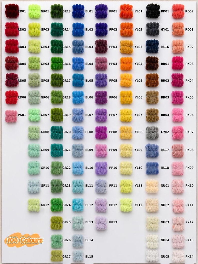 May include: A color chart displaying 104 small, fuzzy, cylindrical yarn pom-poms arranged in columns and rows. Each pom-pom is labeled with a unique alphanumeric code such as RD01, GR01, or BL01. The text 104 Colours is printed in orange at the bottom left.