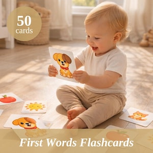 May include: A baby is playing with flashcards on a wooden floor. The flashcards feature illustrations of a dog, tomato, sun, and cat. The text "First Words Flashcards" is visible. The image also includes a circle with the text "50 cards".