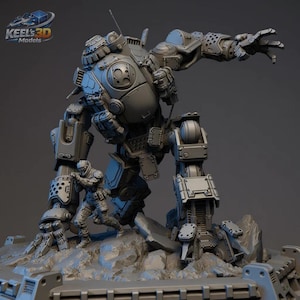 May include: A detailed grey model of a large, mechanical robot with articulated limbs, standing over smaller figures. The robot has intricate paneling and a circular emblem. The base is a rocky terrain. The logo "KEELS 3D Models" is in the top left corner.