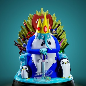May include: A detailed figurine of the Ice King from Adventure Time, seated on a throne with two penguins. The Ice King is blue with a yellow crown and holds a sword. The throne is surrounded by swords and a shield.