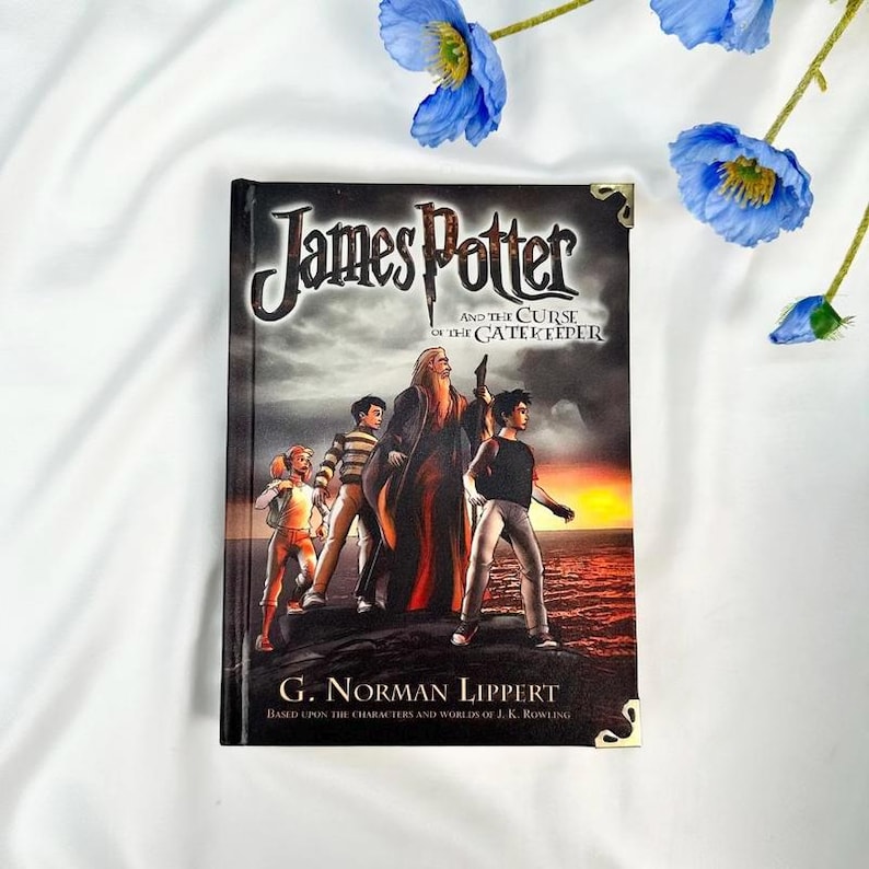 May include: A hardcover book titled "James Potter and the Curse of the Gatekeeper" by G. Norman Lippert. The cover features illustrations of characters and a wizard against a sunset backdrop. The book is decorated with gold corner accents.