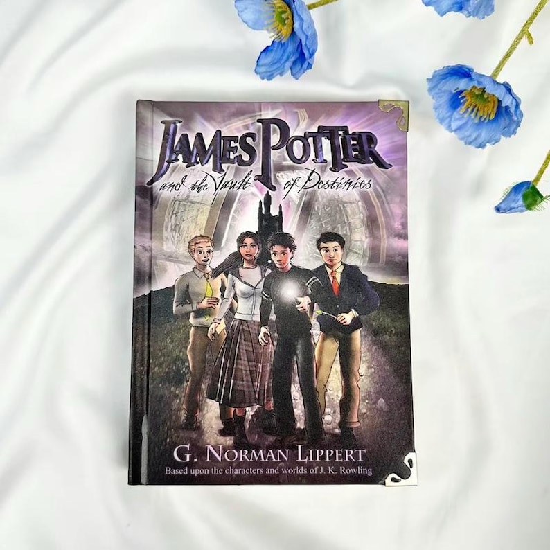 May include: A hardcover book titled "James Potter and the Vault of Destinies" featuring four young characters on the cover. The book's cover has a dark, fantasy-themed illustration with the author's name and a tagline at the bottom.