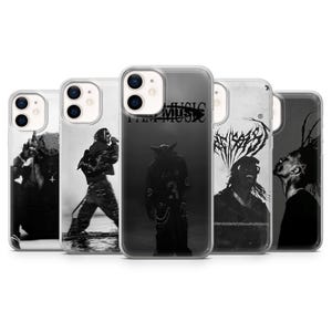 May include: A collection of five black and white phone cases. Each case features a different image of a musician or band member. The cases are made of a clear material and have a glossy finish. The text "I AM MUSIC" is visible on one case.