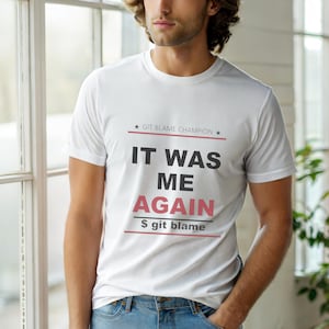 May include: White t-shirt with the text "IT WAS ME AGAIN" in black and red, and "$ git blame" in black. The shirt also has the text "GIT BLAME CHAMPION" above the main text.