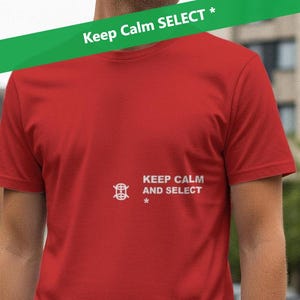 May include: A red t-shirt featuring the text "KEEP CALM AND SELECT" in white. The shirt has a crew neck and short sleeves. A green banner with the words "Keep Calm SELECT *" is across the top of the image.
