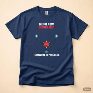 May include: A navy blue t-shirt featuring the text "MERGE NOW DEBUG LATER" in white and red. Below is a graphic of a smiling red star with blue circles and the text "TEAMWORK IN PROGRESS" in white.