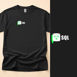 May include: A black short-sleeved t-shirt featuring a graphic on the left chest. The graphic depicts a white cylindrical database icon with a green ninja mask design and the text SQL in white capital letters next to the icon.