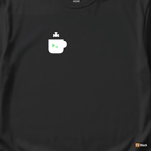 May include: Black t-shirt with a white coffee cup graphic, a green command prompt symbol, and a small white design above. Made from heavy cotton.