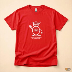 May include: A red t-shirt with a white robot graphic. The robot has a round body, two eyes, and a waving arm. The text "ERROR 404 DEADLINE APPROACHING" is printed below the robot.