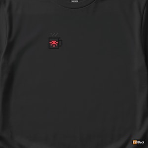 May include: Black t-shirt with a pixelated red coffee cup design on the upper left chest. The cup has steam rising from it. The shirt is made of heavy cotton.