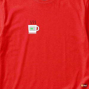 May include: Red t-shirt with a white coffee mug graphic, a green terminal prompt, and steam rising. The mug design is on the left. The shirt is made of a soft material. A simple design for tech enthusiasts.
