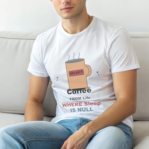 May include: White t-shirt with a coffee mug graphic. The mug is peach-colored with a red rectangle that says "SELECT". Below the mug, the text reads "Coffee FROM Life WHERE Sleep IS NULL". The shirt is worn by a person.