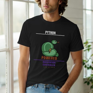 May include: Black t-shirt with the word "PYTHON" above a green snake illustration with a lightning bolt. Below the snake, the word "POWERED" is above "INDENTATION CONTROLLED". The shirt is worn by a person.