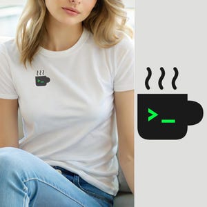 May include: A white short-sleeved t-shirt featuring a small black coffee mug graphic on the left chest. The mug icon includes three wavy steam lines above it and a bright green command line prompt symbol consisting of a greater-than sign and an underscore.
