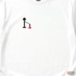 May include: White t-shirt with a pixelated graphic. The graphic features a black figure with a red element. The shirt is made of a heavy cotton material.