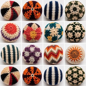 May include: A collection of sixteen spherical crochet balls featuring various patterns and color combinations, including stripes, floral motifs, and geometric designs in shades of red, black, orange, blue, green, purple, yellow, and cream.
