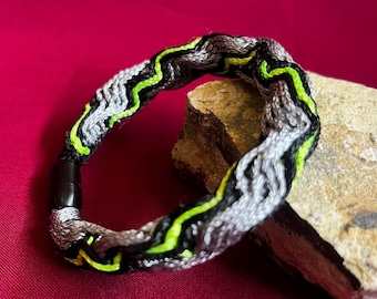 The Viper-Braided Handcrafted paracord bracelet. Eye-Catching zigzag pattern. Bold, durable. Magnetic clasp. Military-grade. Stunning piece