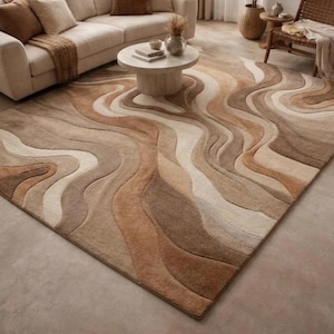 Könnte beinhalten: Ein Set aus drei Keramikbechern mit gesprenkelter, matter Oberfläche. Die Becher sind in Creme-, Hellgrau- und Dunkelgrautönen gehalten. Jeder Becher hat ein schlichtes, minimalistisches Design.