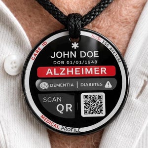 May include: A white ceramic mug with a black handle and the text "But First, Coffee" in a black, bold font. The mug is on a white surface.